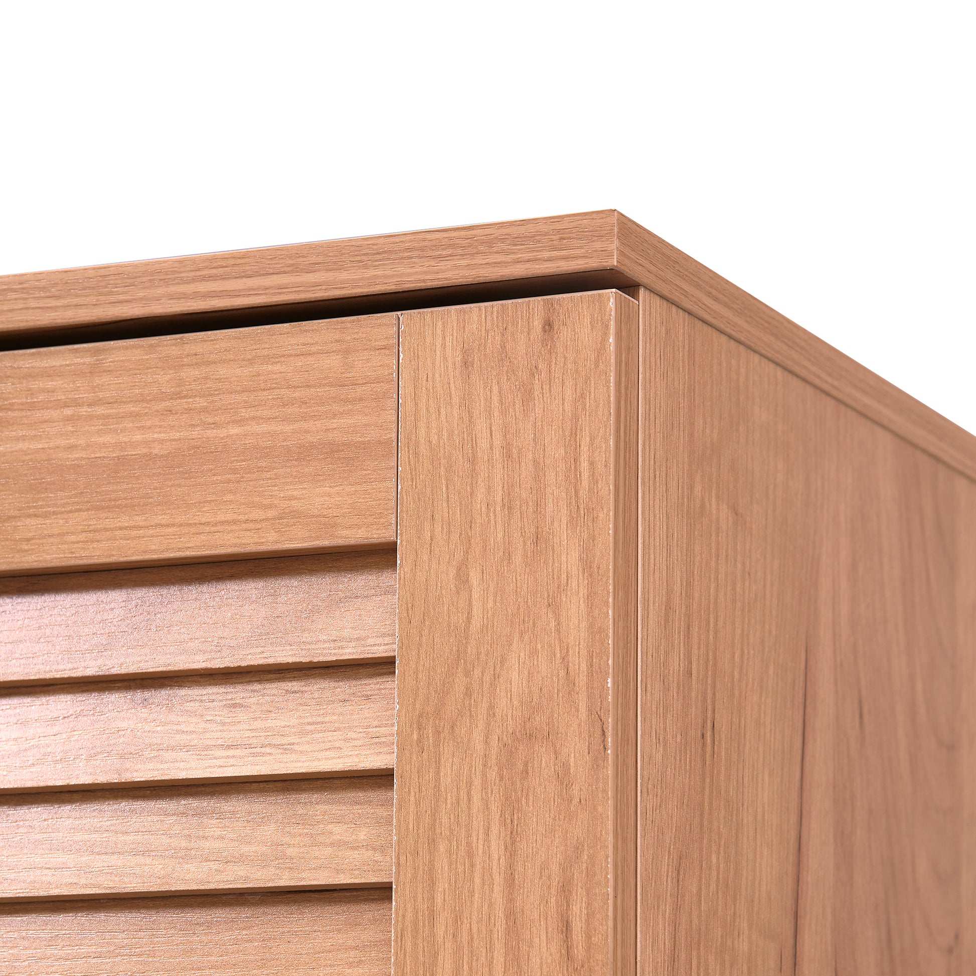 Closeup of natural wood veneer cabinet door with louvered panel detail