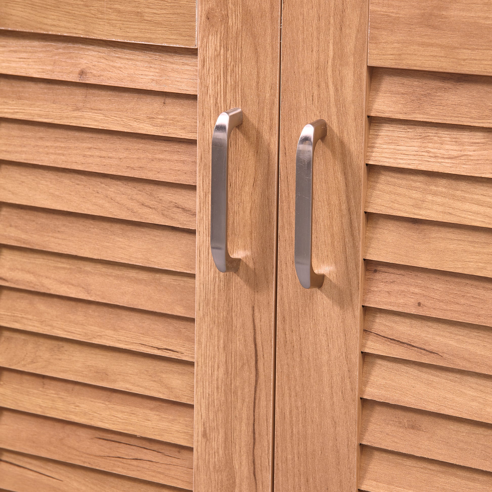 Wooden cabinet doors with louvered detail and brushed nickel handles