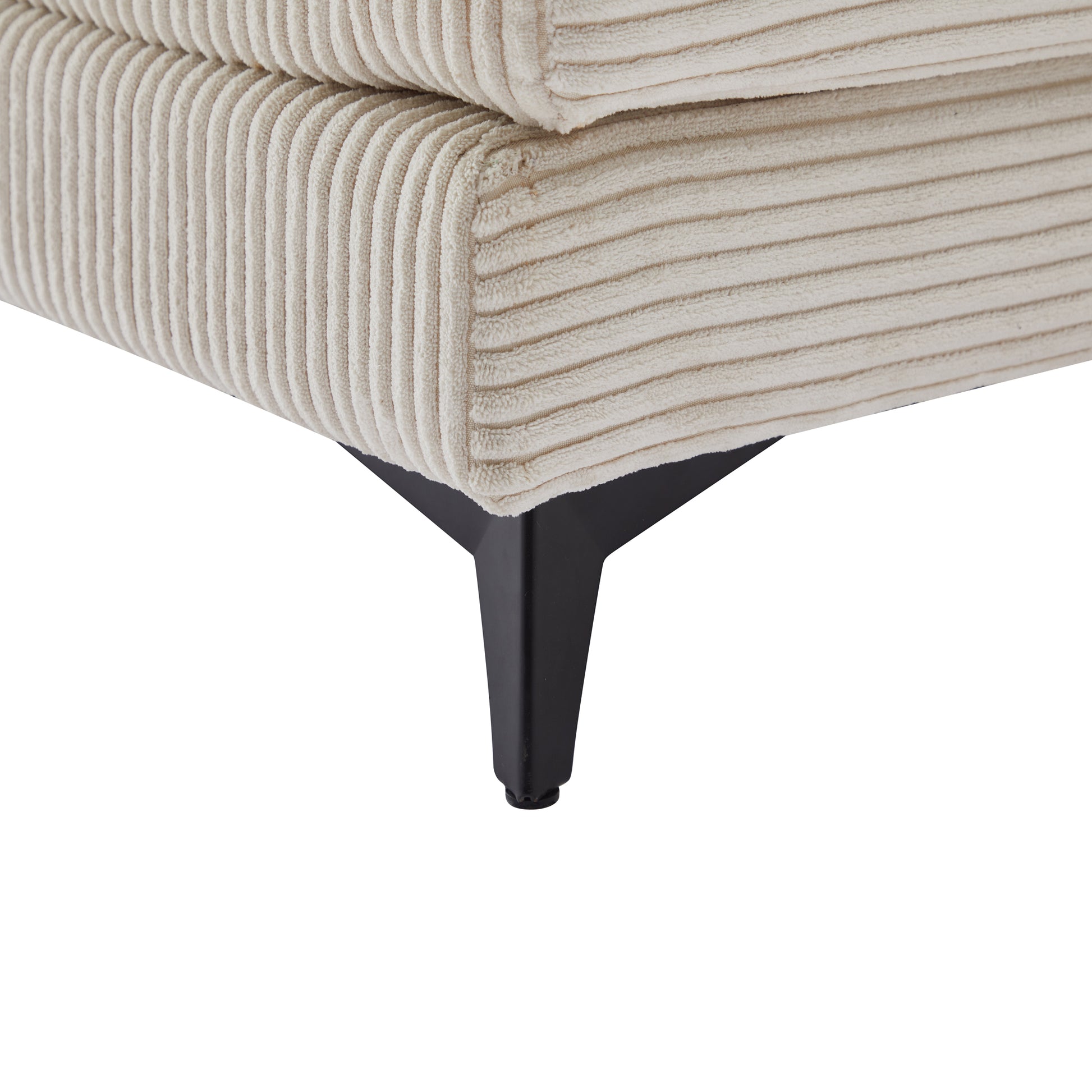 Cream corduroy couch detail with black metal legs