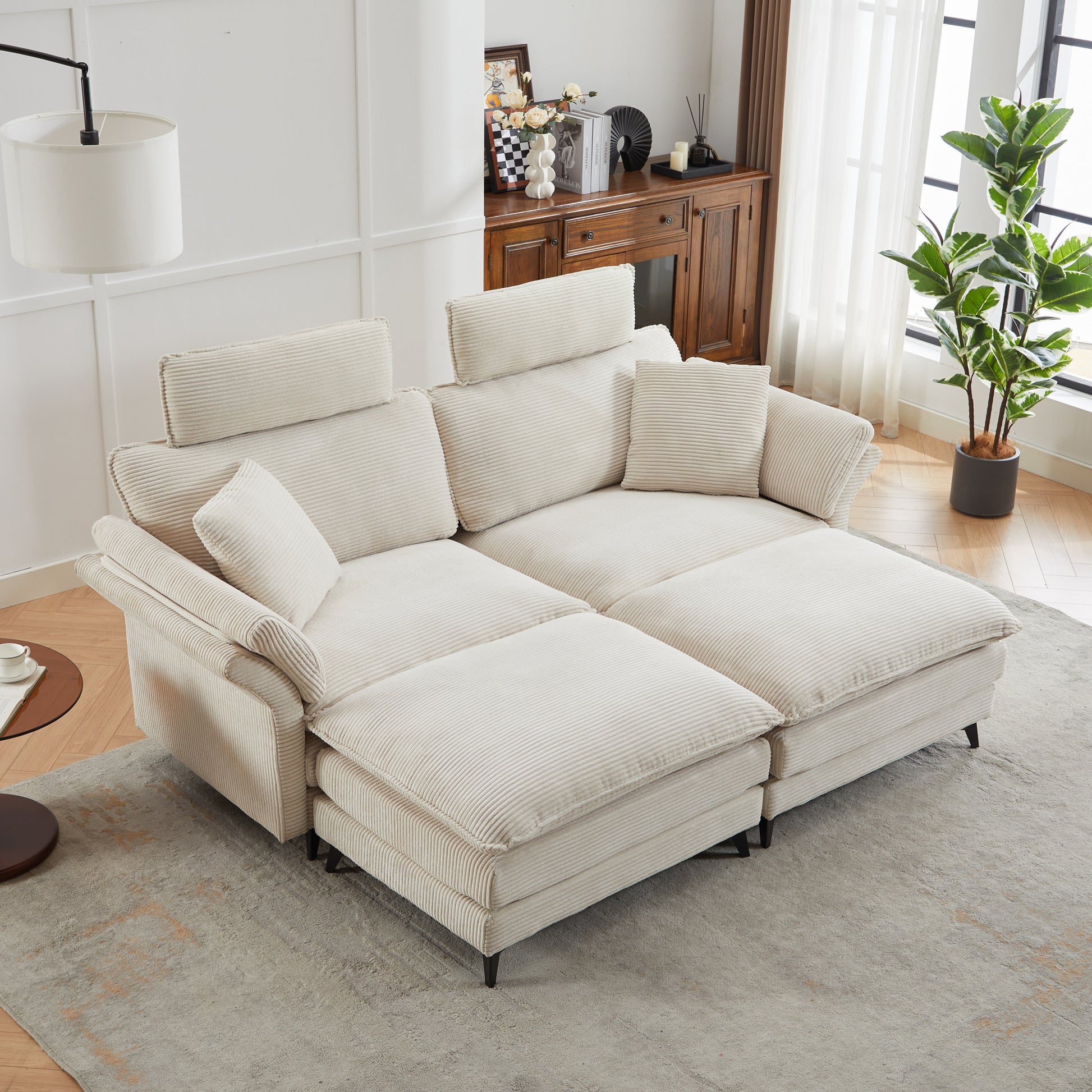 Cream corduroy sectional sofa with adjustable headrests and throw pillows for a modern living room