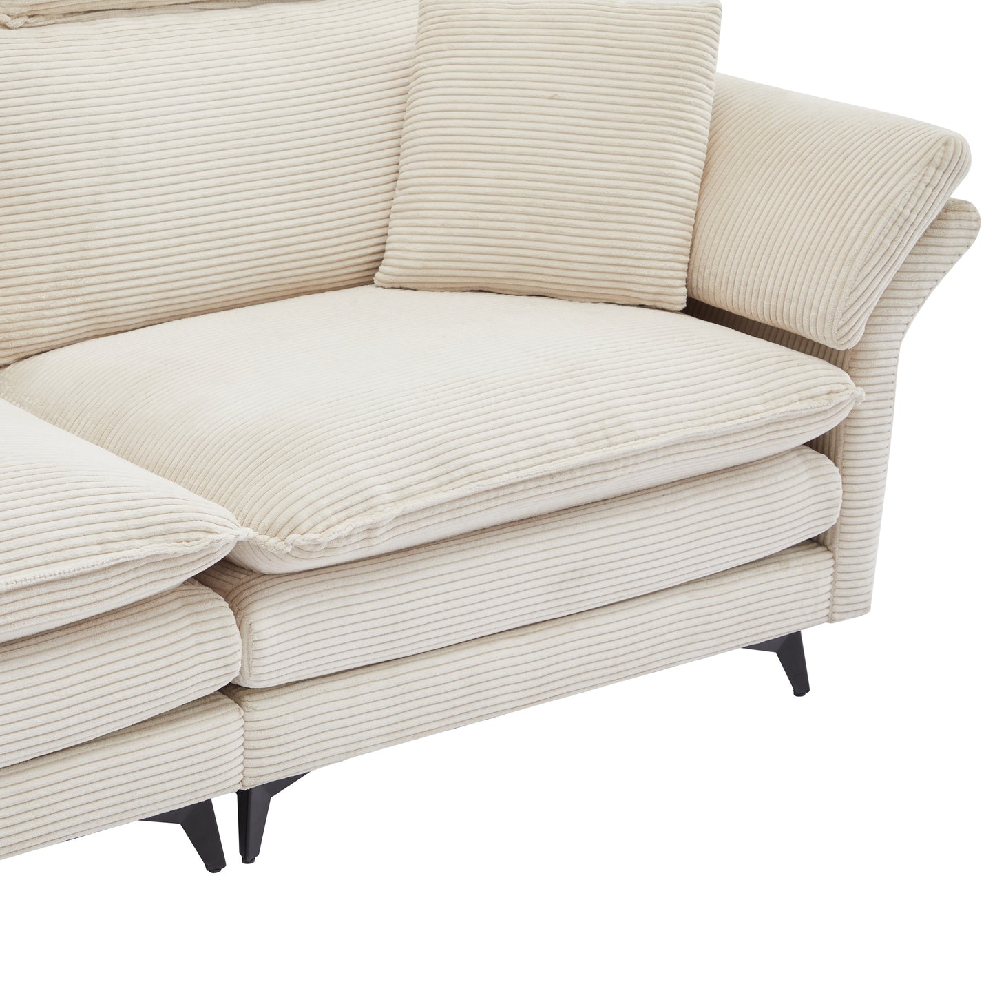 Closeup of a textured beige corduroy sofa with plush cushions and black legs