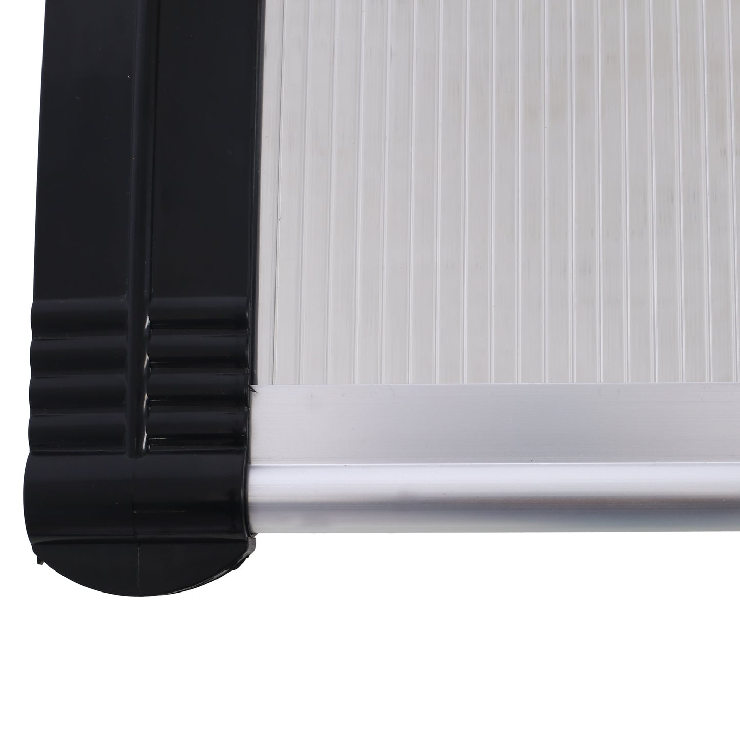 Closeup of a black plastic trim with ribbed detailing on a white ribbed panel