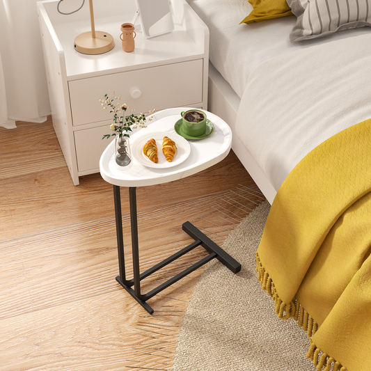 White ctable with marble top holding breakfast with croissants and coffee