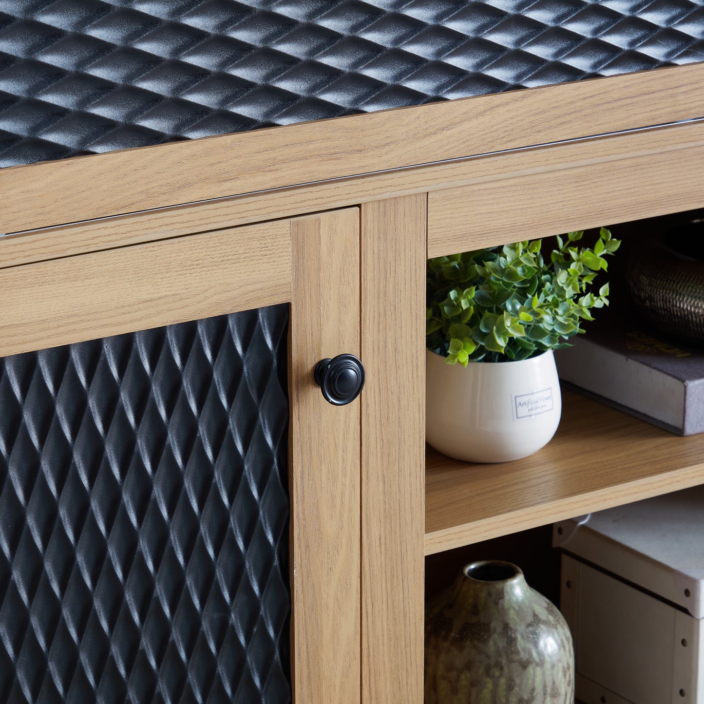 Rustic wood media console with black textured door and antique brass hardware