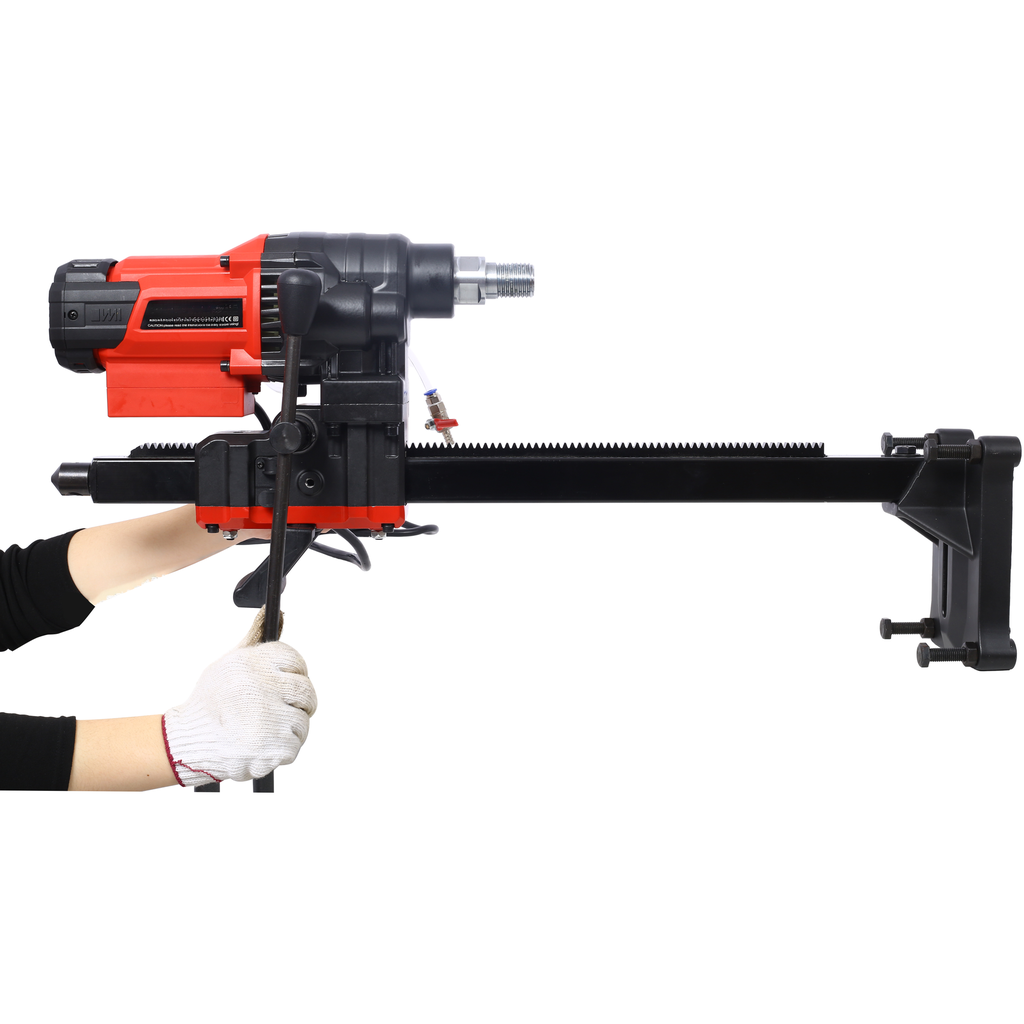 Red and black core drill machine with guide rail mounted for concrete drilling