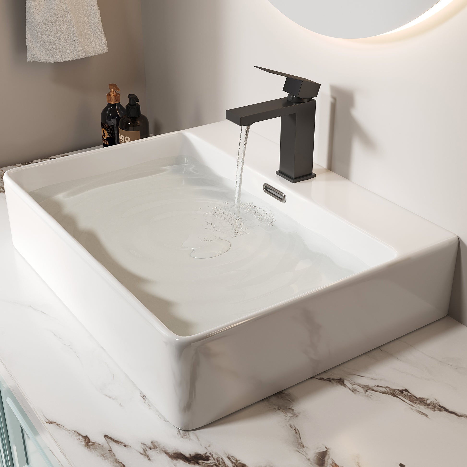 Matte black modern bathroom faucet with clean lines filling a white rectangular vessel sink