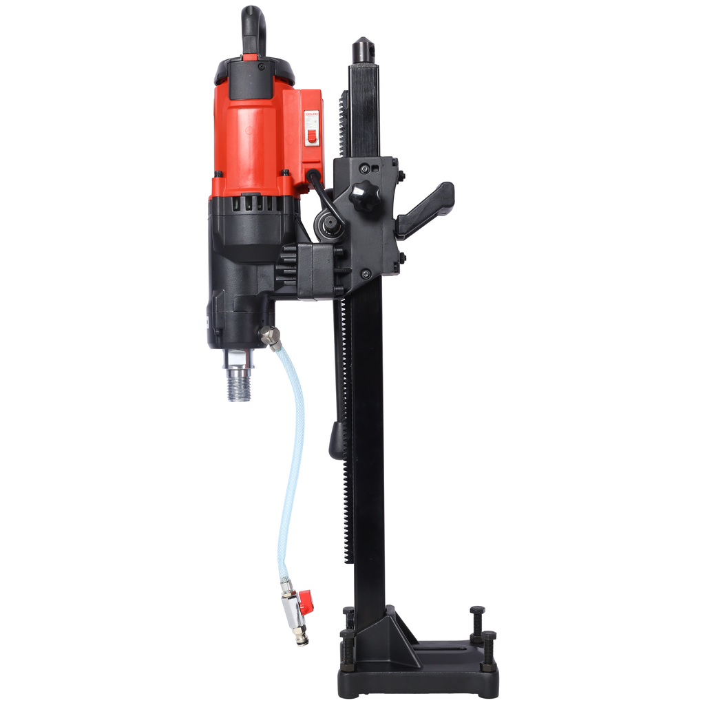 Red and black core drill with water hose attachment on sturdy stand