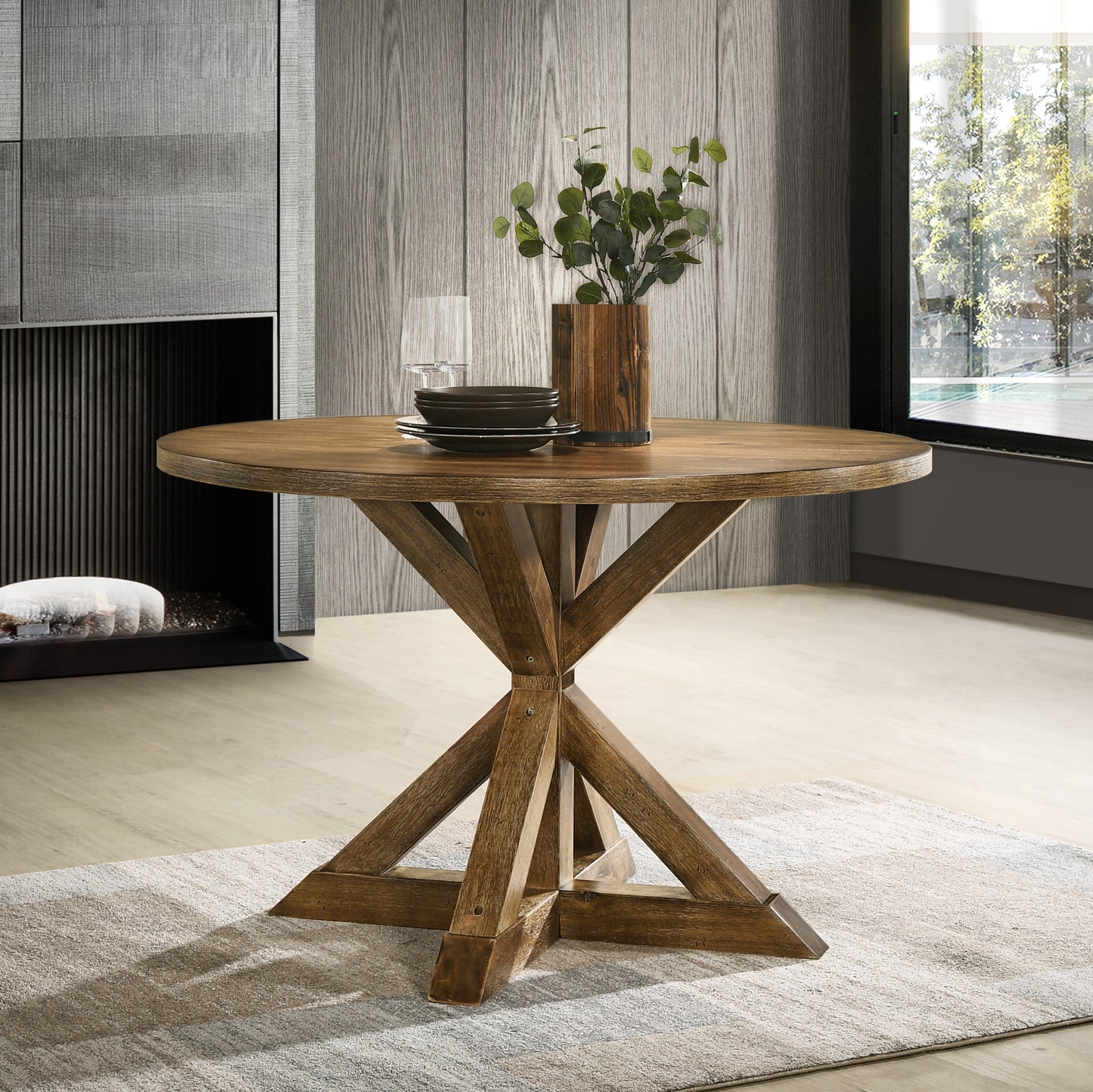 Rustic round oak dining table with a carved pedestal base