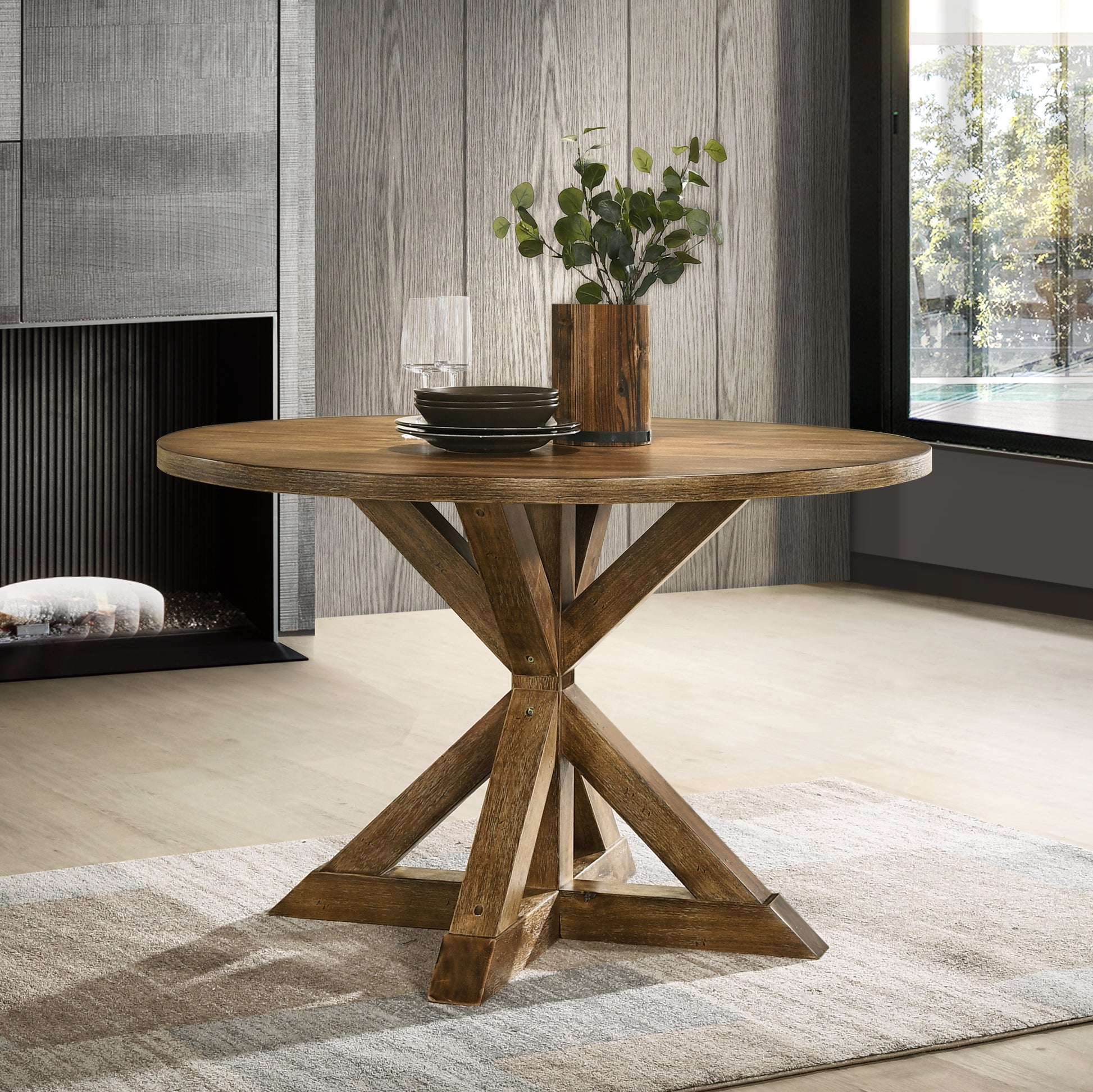 Rustic round oak dining table with a carved pedestal base