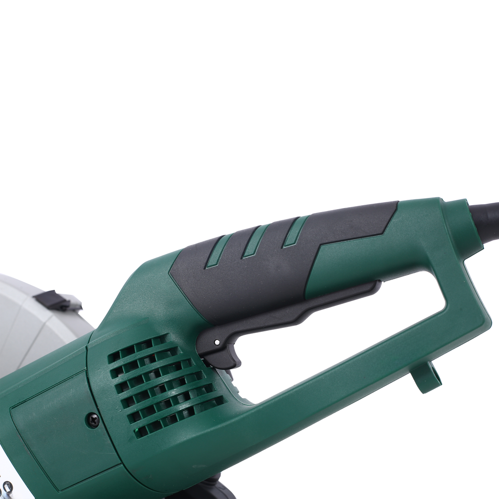Green and black grip of a powerful miter saw