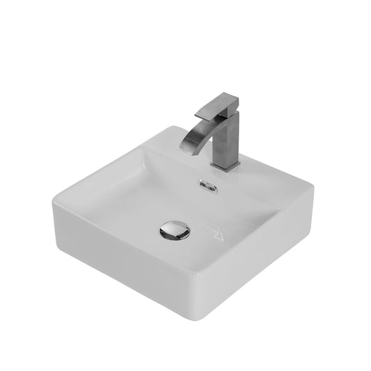 Modern white ceramic vessel sink with a brushed nickel waterfall faucet