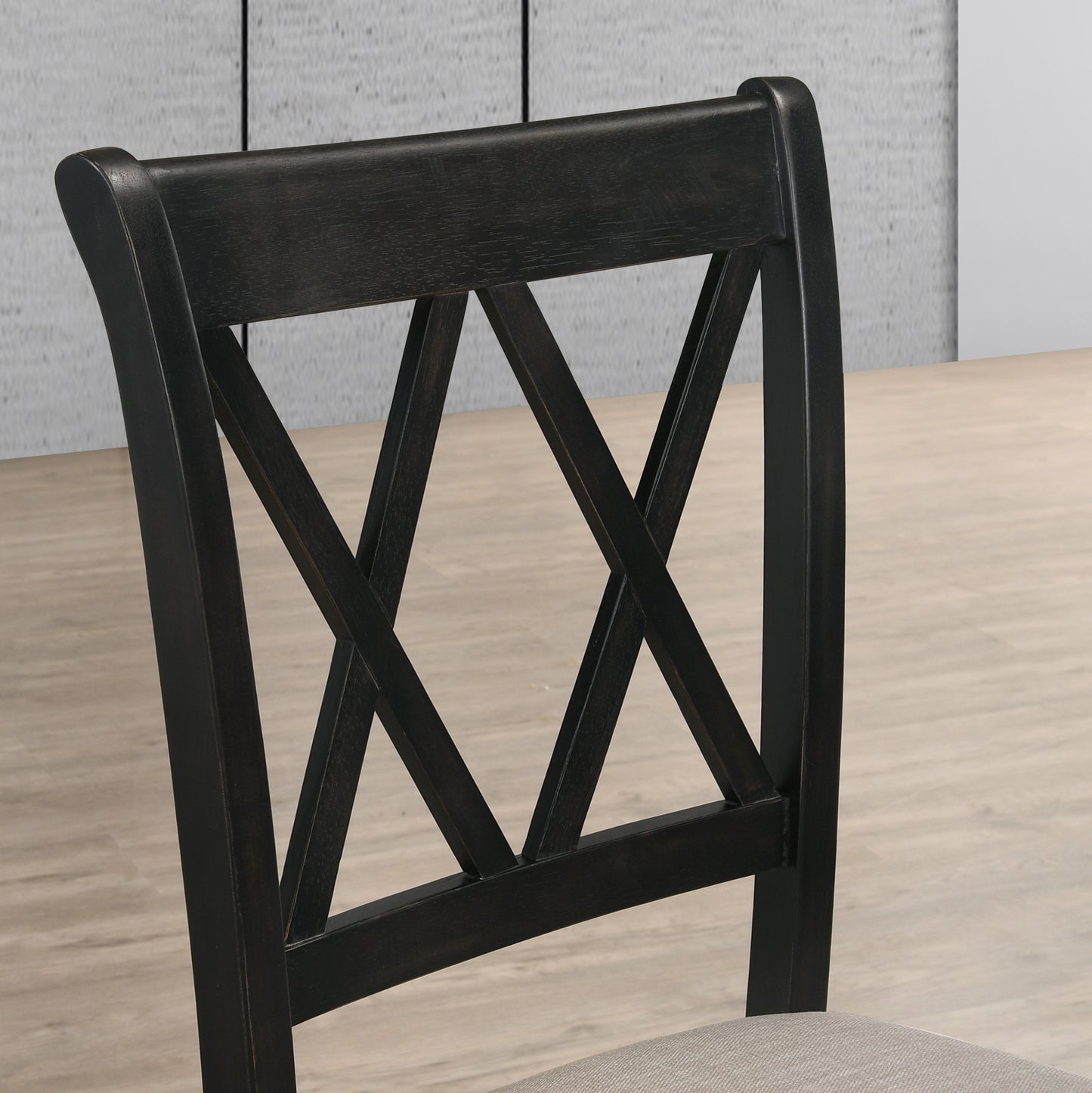 Dark wood dining chair with crisscross backrest detail