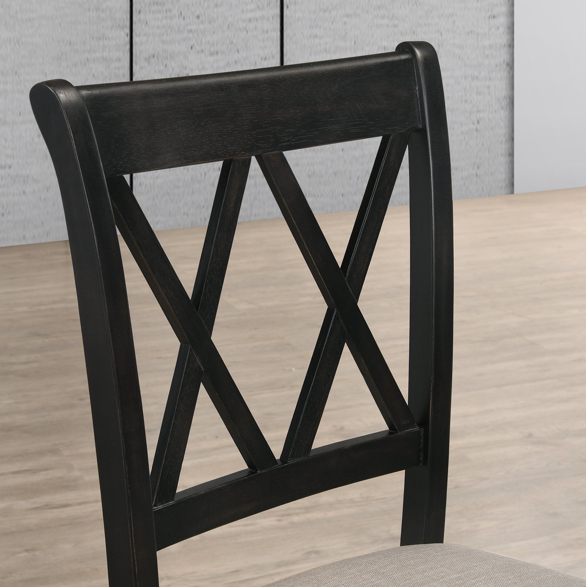 Dark wood dining chair with crisscross backrest detail