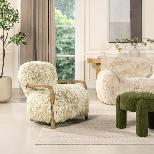 Cream boucle armchair with natural wood accents and plush shag upholstery