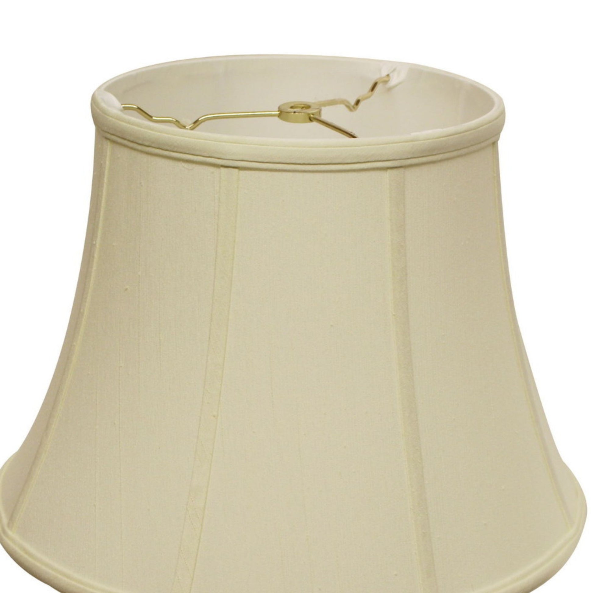 Cream bell lampshade with gold finial hardware and pleated fabric texture