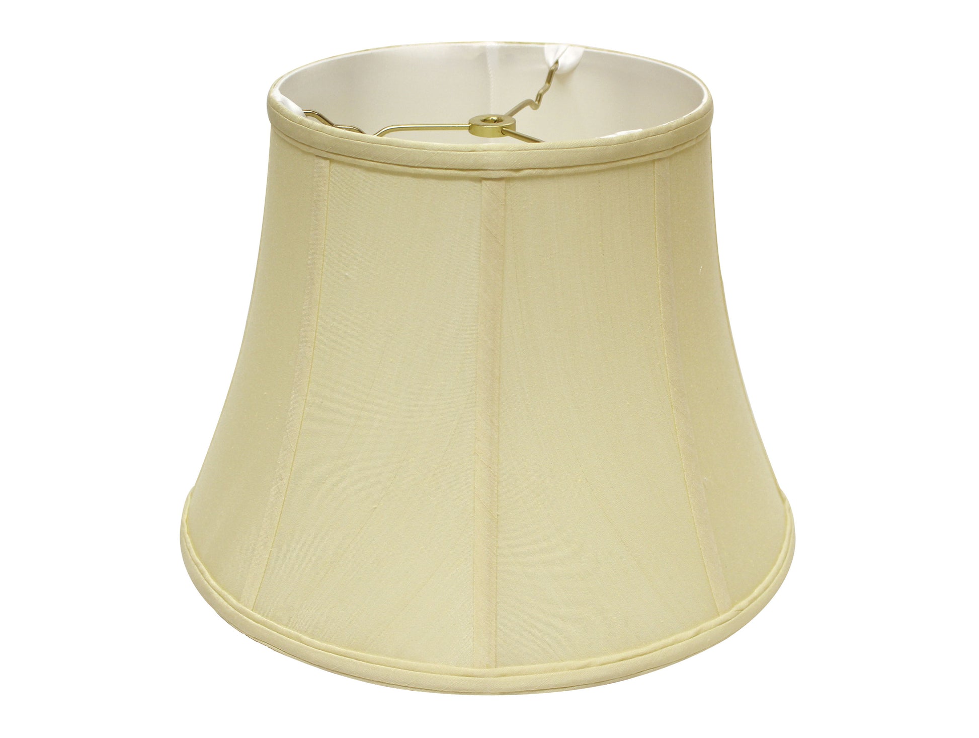 Creamcolored bell lampshade made of fabric with a gold finial and hardware
