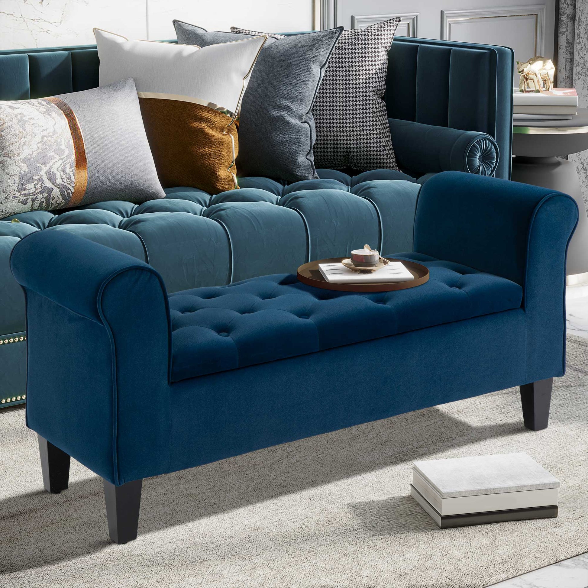 Navy velvet storage bench with tufted seat and rolled arms