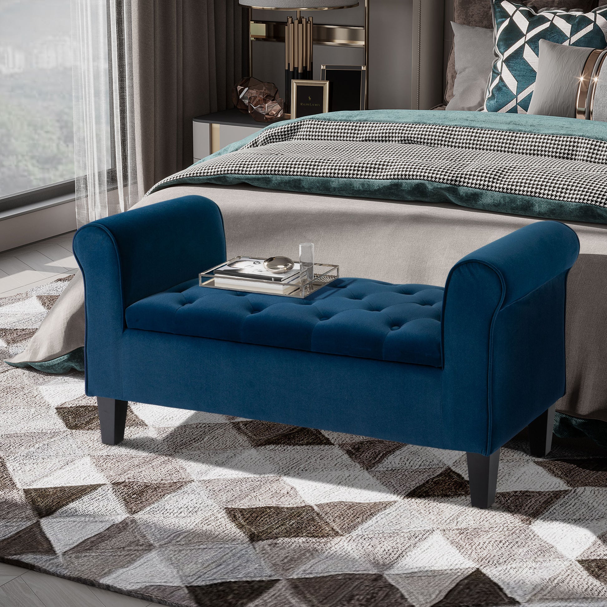 Deep blue velvet bench with button tufting and rolled arms
