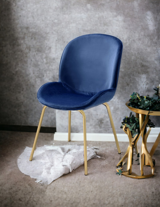 Elegant navy blue velvet accent chair with sleek gold legs