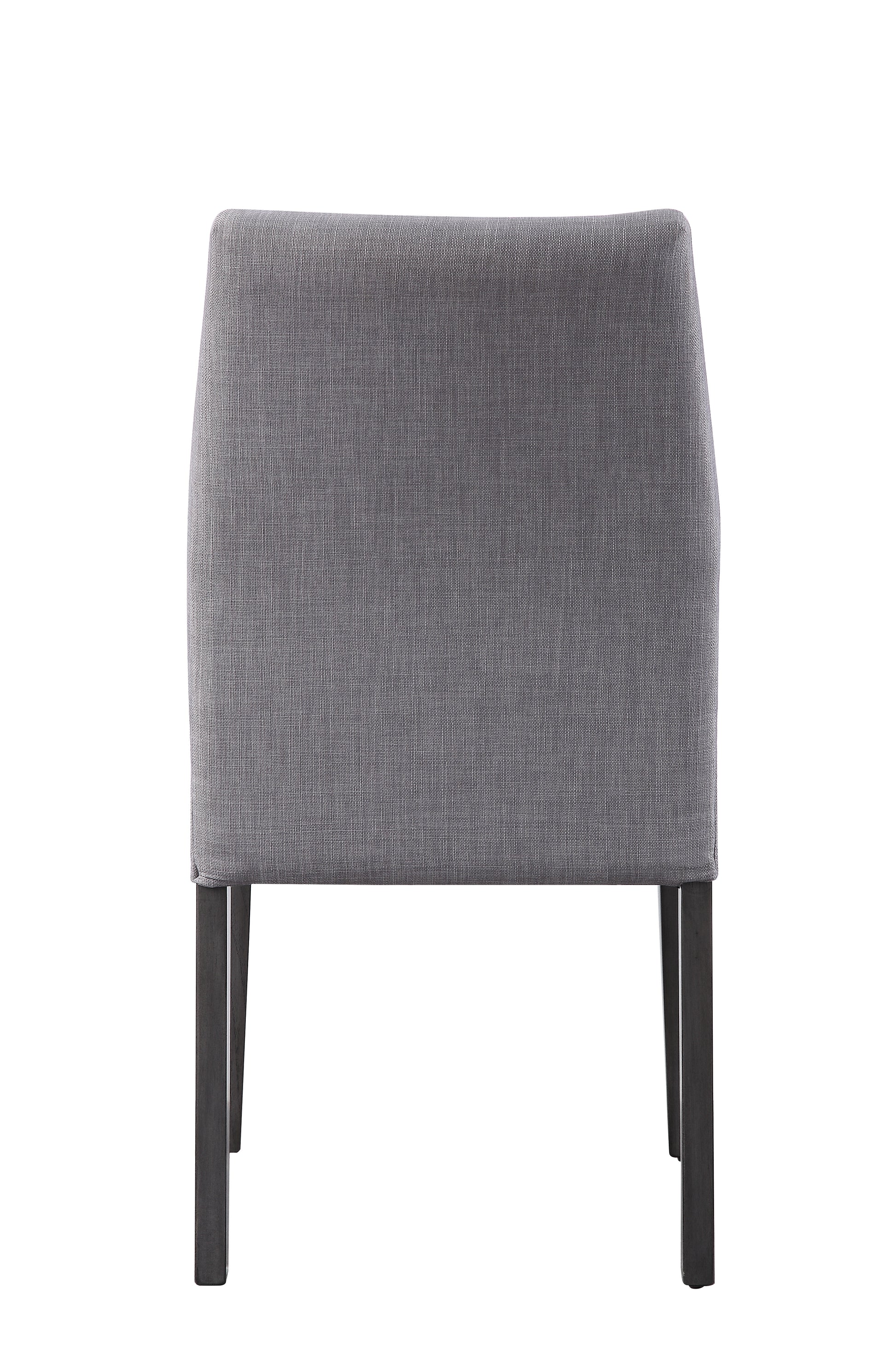 Gray upholstered dining chair with dark wood legs