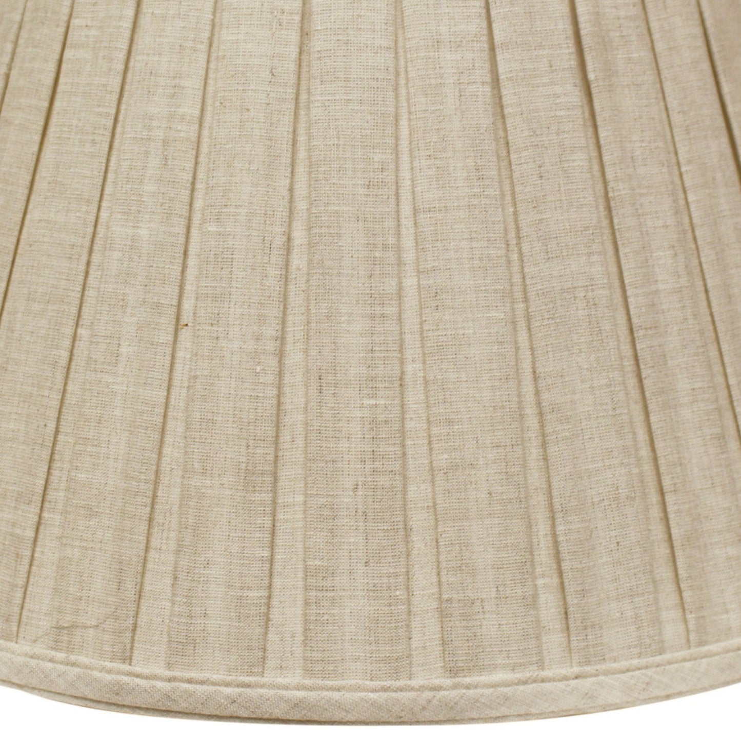 Textured natural linen lampshade with delicate pleats providing warm diffused light