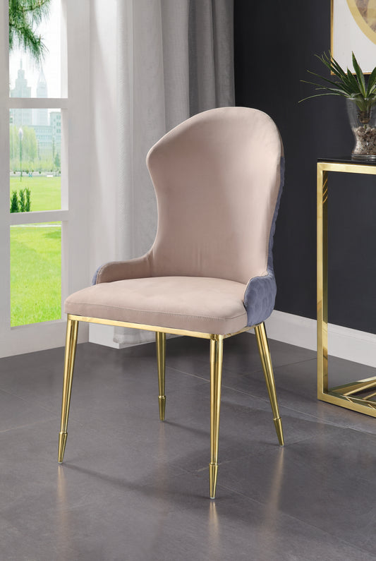 Elegant beige velvet dining chair with blue quilted back and gold legs