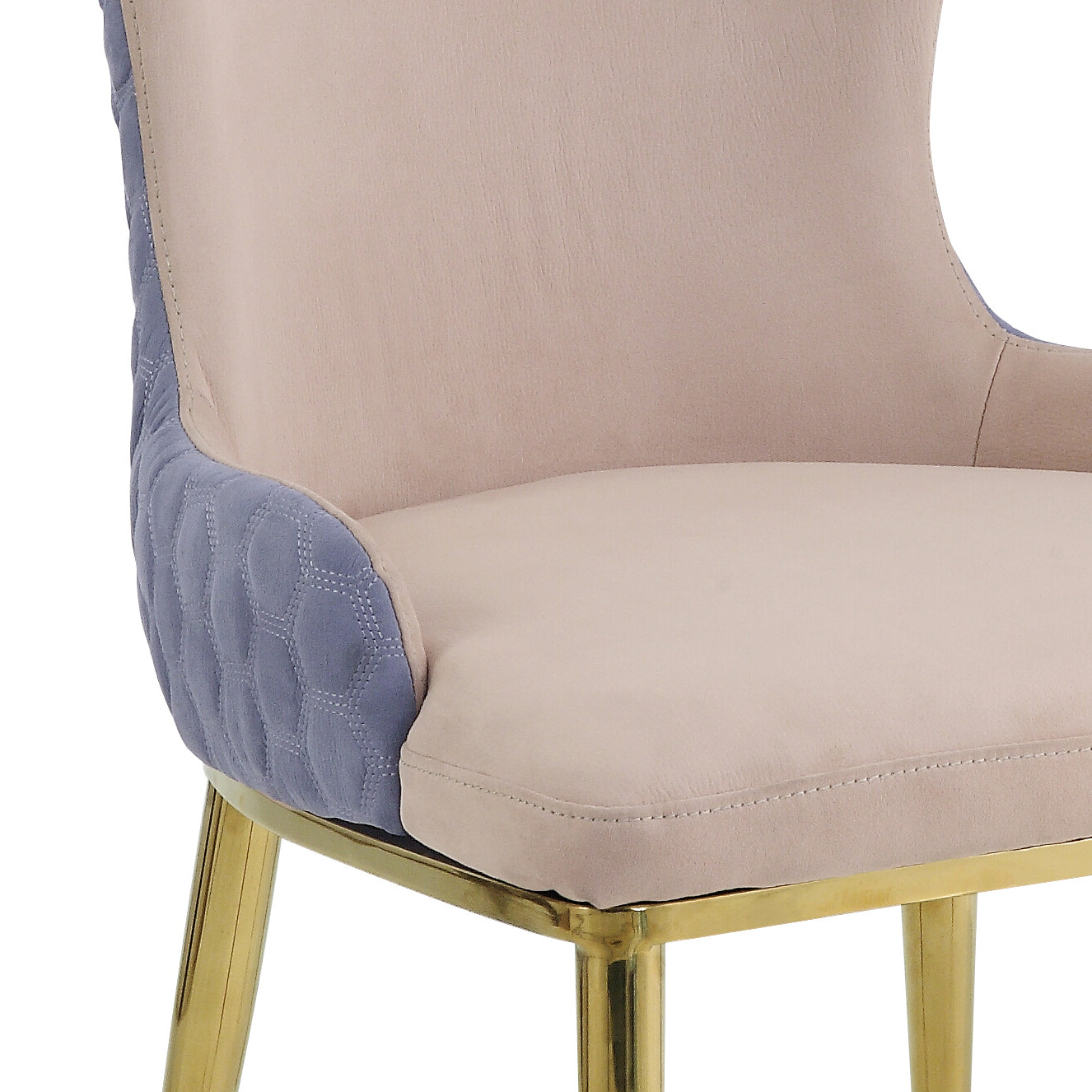 Beige upholstered accent chair with quilted blue side panels and gold legs