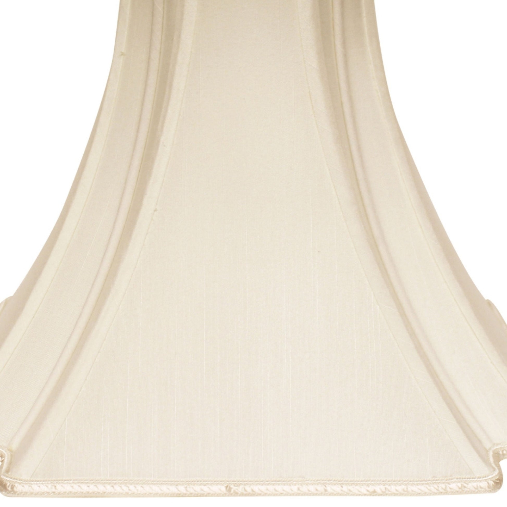Cream pleated bell lampshade with decorative trim at the bottom edge