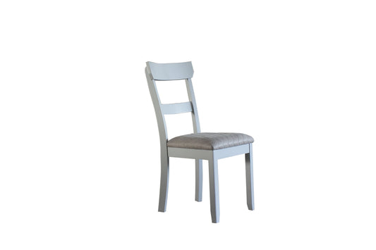 Light gray wooden dining chair with quilted taupe upholstered seat