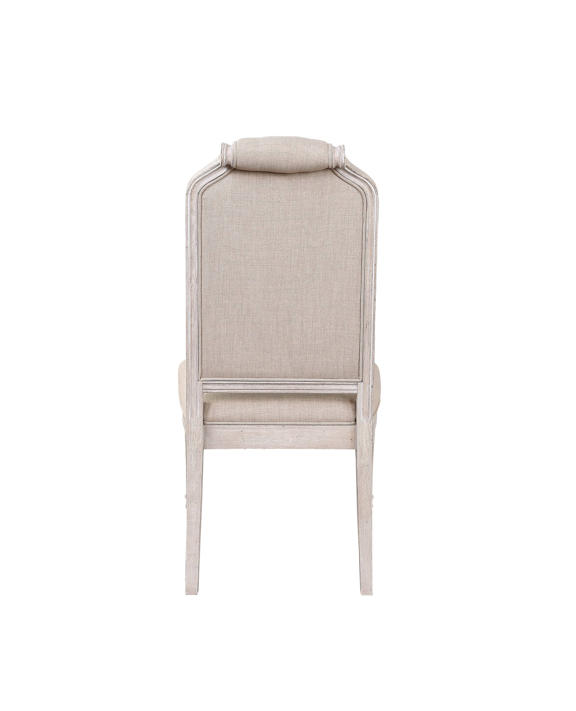 Distressed white wood accent chair with light beige upholstered back and seat