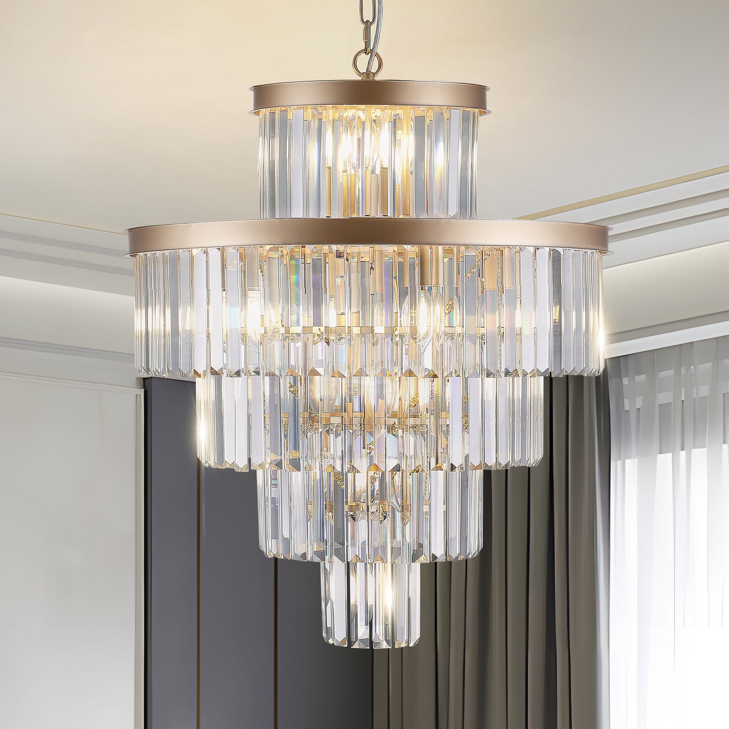 Elegant multitiered crystal chandelier with warm brass accents ideal for dining rooms