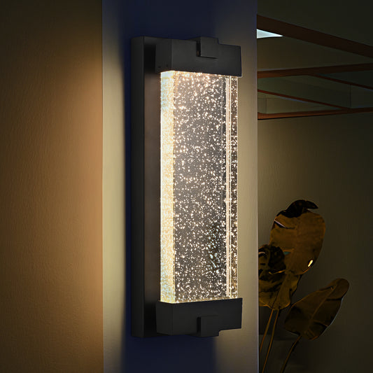 Modern black outdoor wall light with clear bubble glass and LED illumination