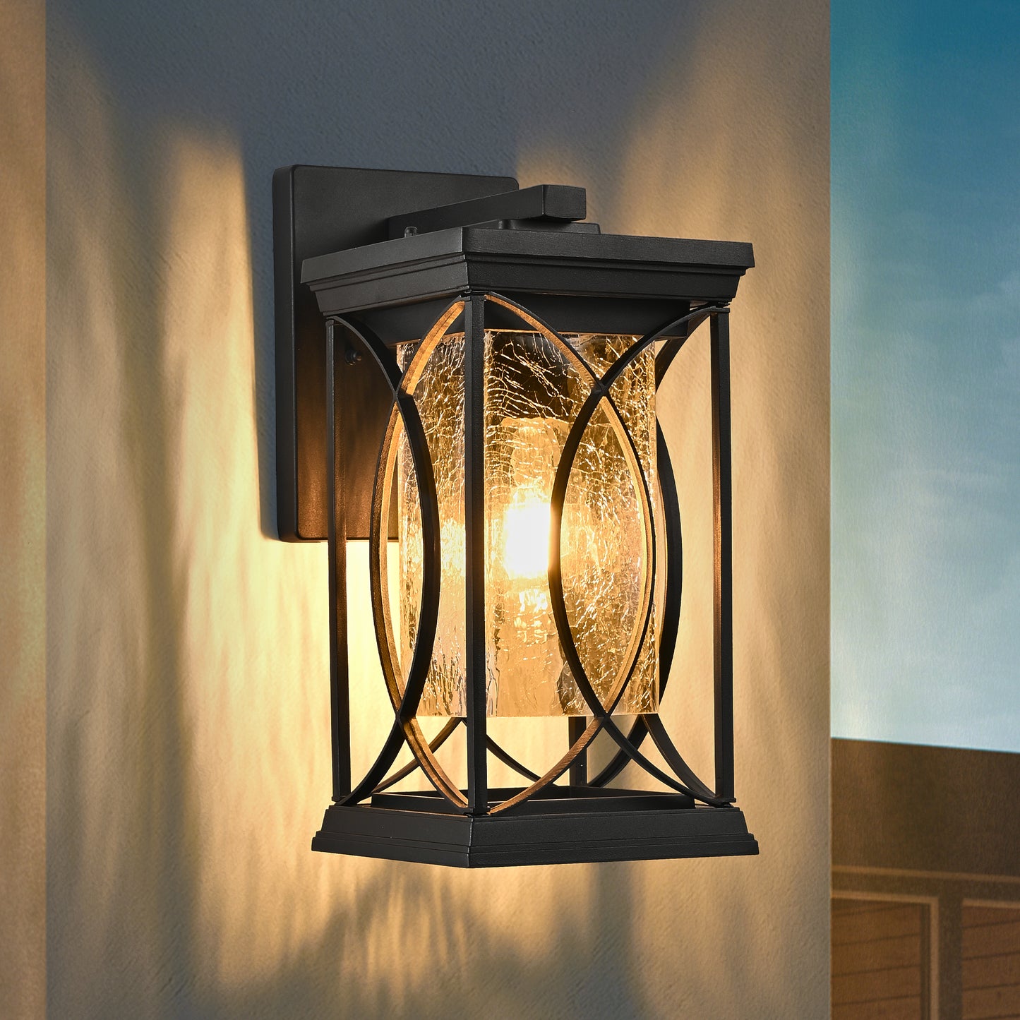 Black outdoor wall lantern with crackled glass and ornate metal frame