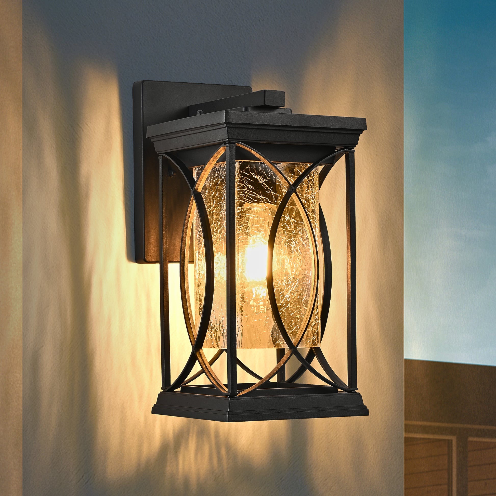 Black outdoor wall lantern with crackled glass and ornate metal frame