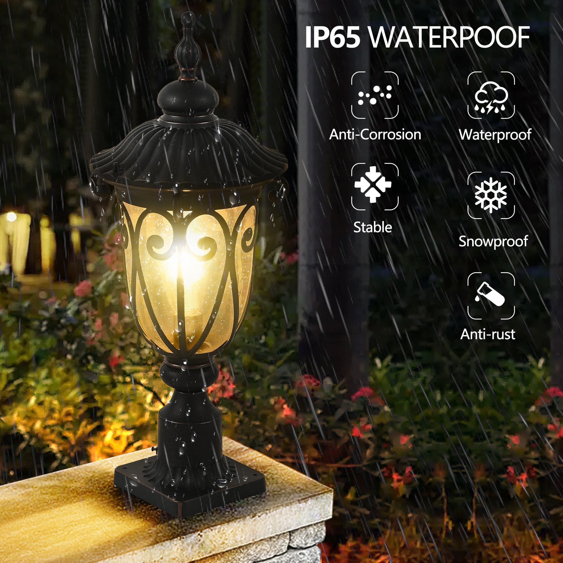 Black ornate outdoor post lamp illuminated with water droplets IP rated