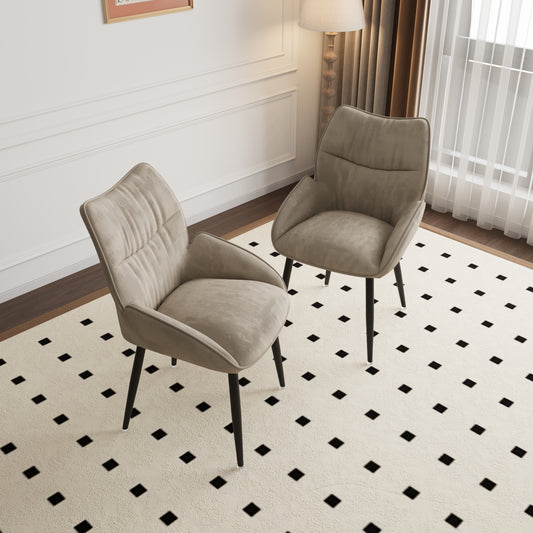 Taupe fabric accent chair with tufted back and black tapered legs