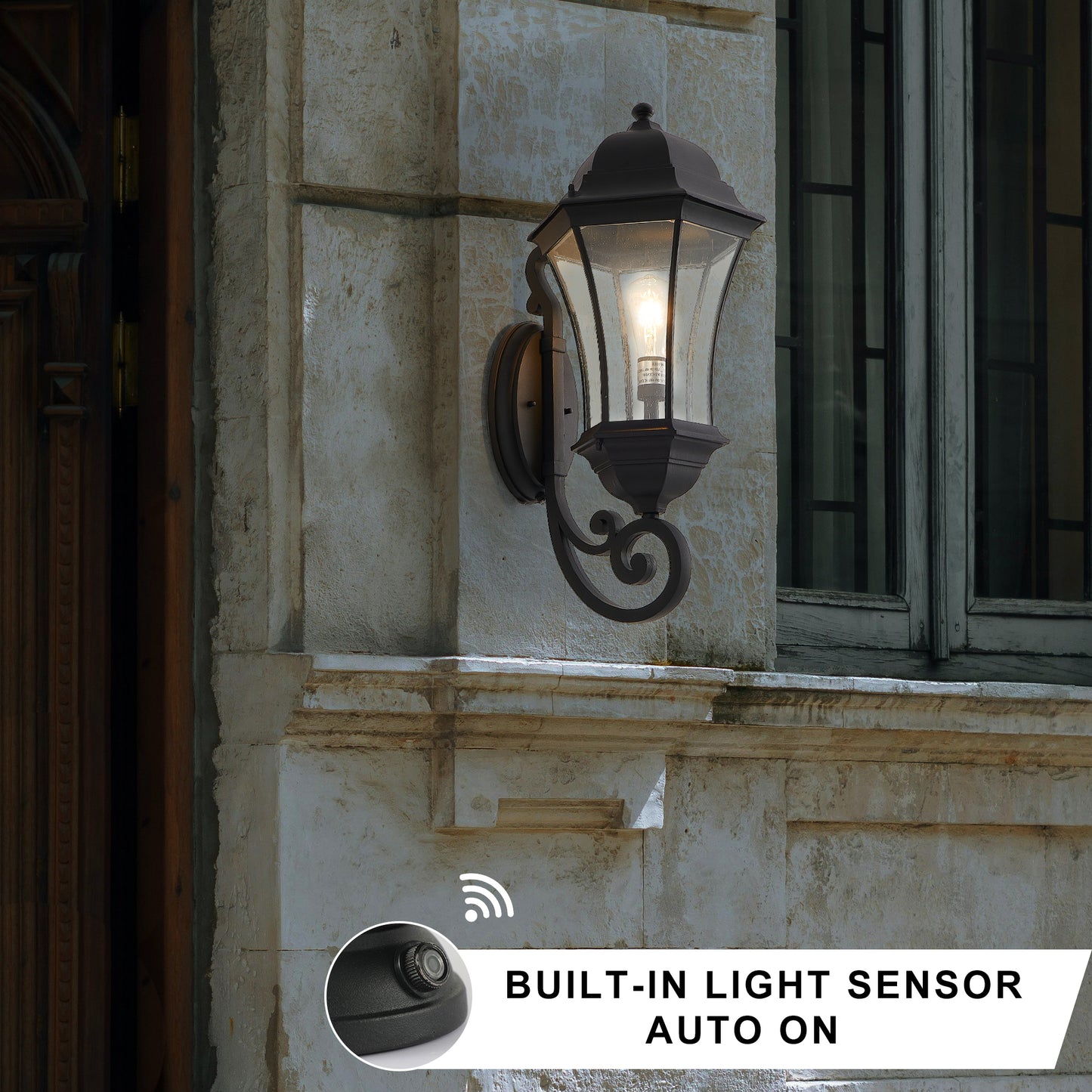 Dark bronze outdoor wall lantern with glass panes and builtin light sensor