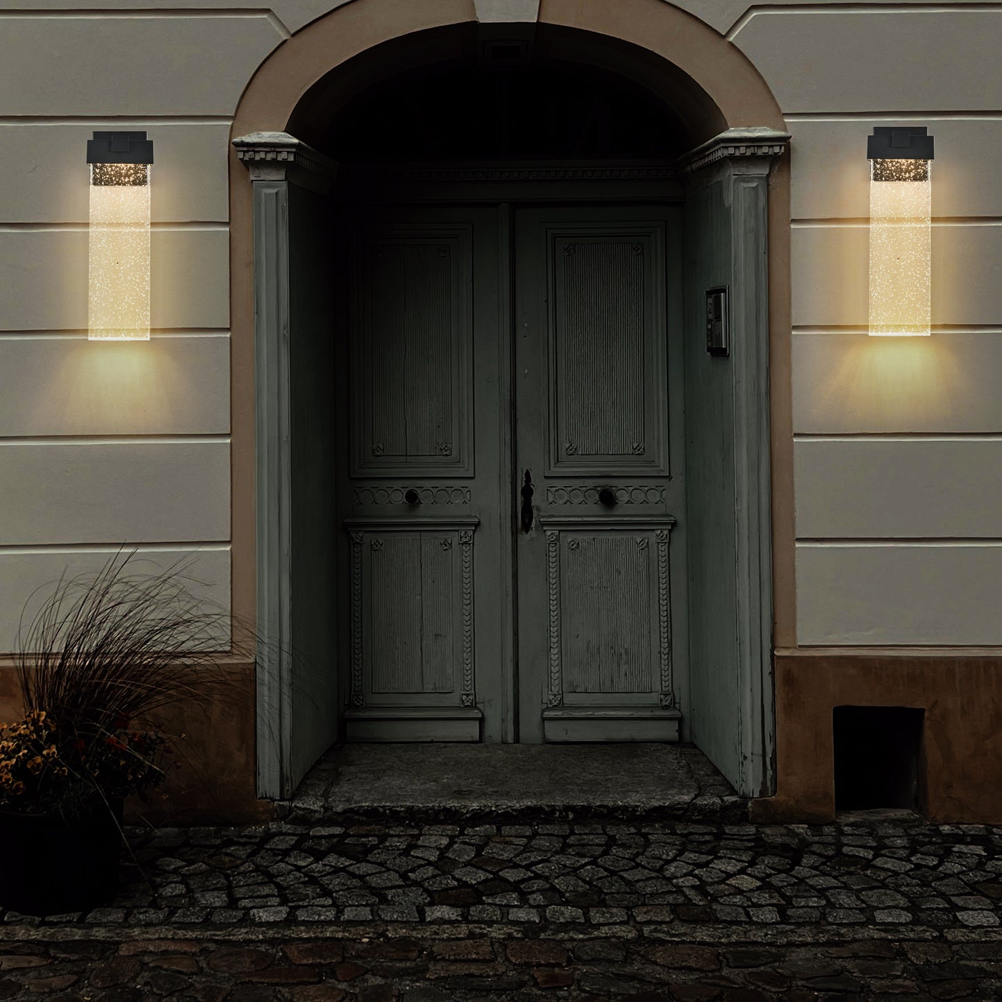 Modern outdoor wall sconce with clear seeded glass and black finish  lumens