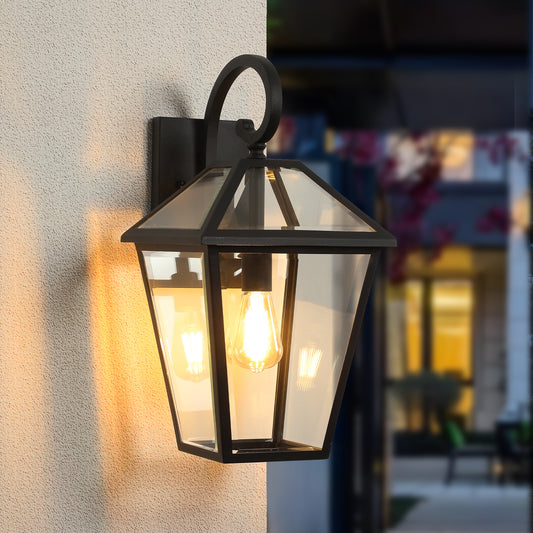 Classic black metal outdoor wall lantern with clear glass panels and exposed bulb