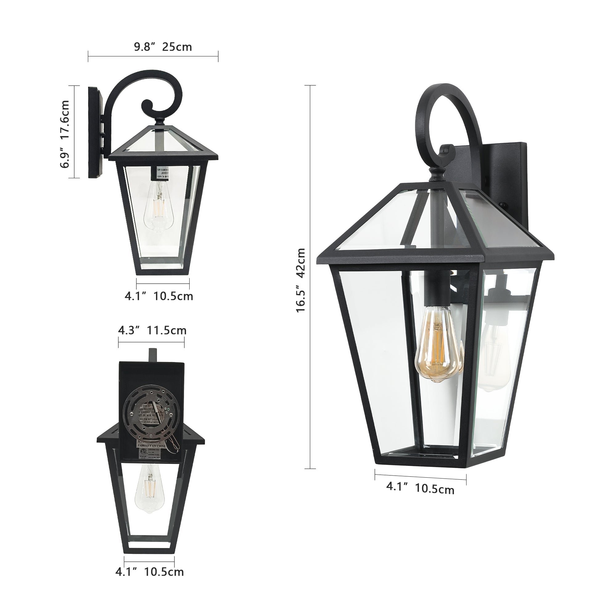 Black hexagonal outdoor wall light with clear glass panels and decorative scroll arm
