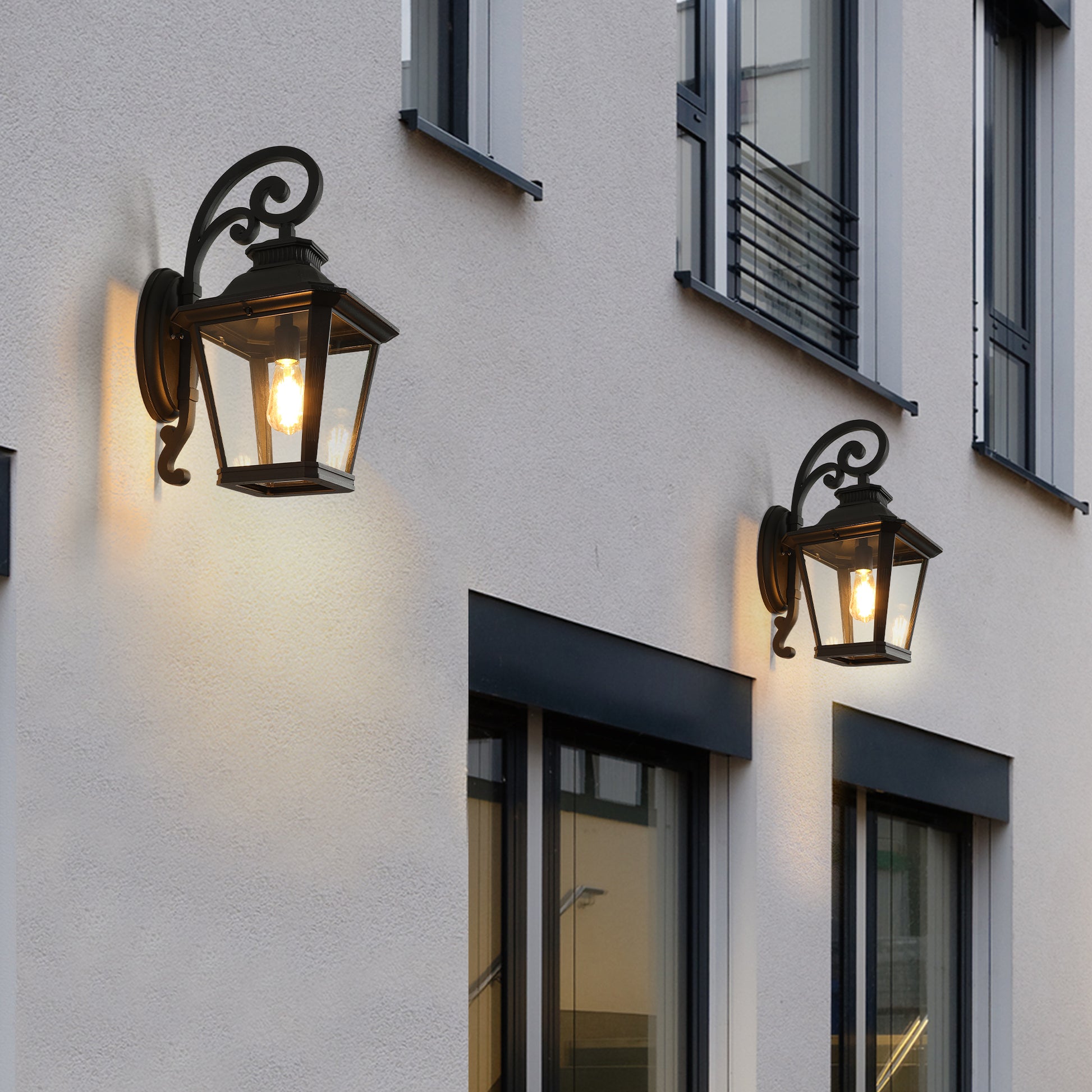 Black traditional lanternstyle outdoor wall sconce with glass panels and ornate bracket