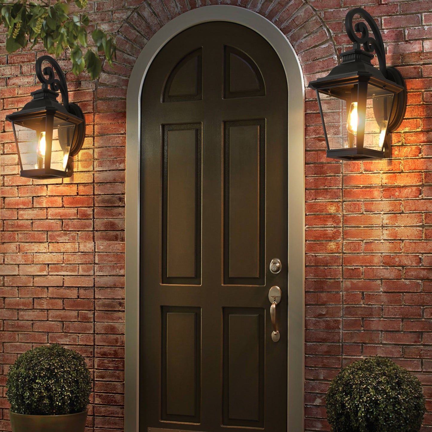 Classic black outdoor wall lantern with clear glass panes ideal for entryway lighting