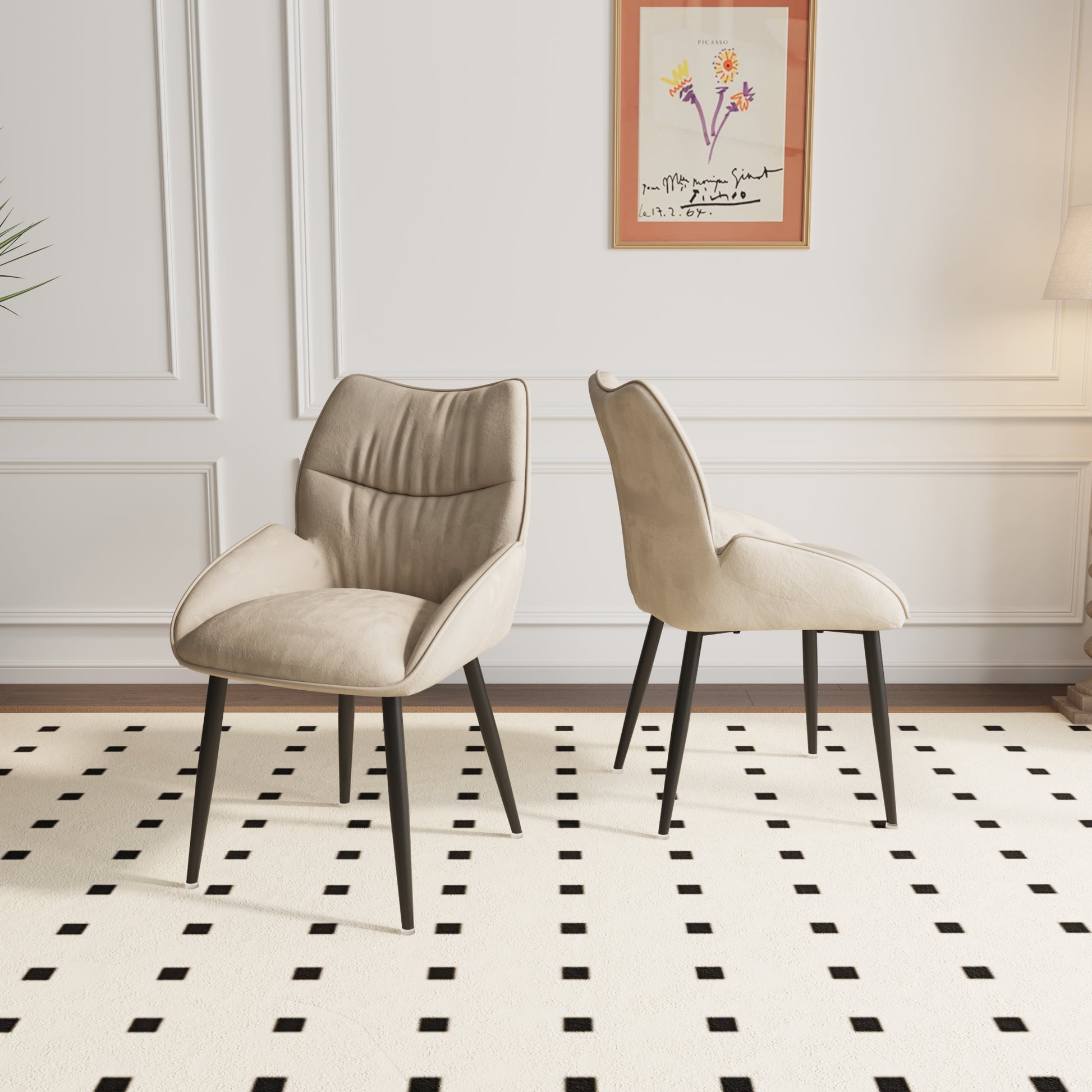 Plush beige upholstered dining chair with elegant tufted back and dark metal legs