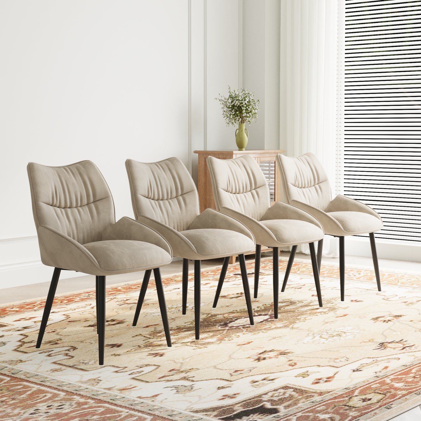 Set of four modern beige fabric dining chairs with black tapered legs