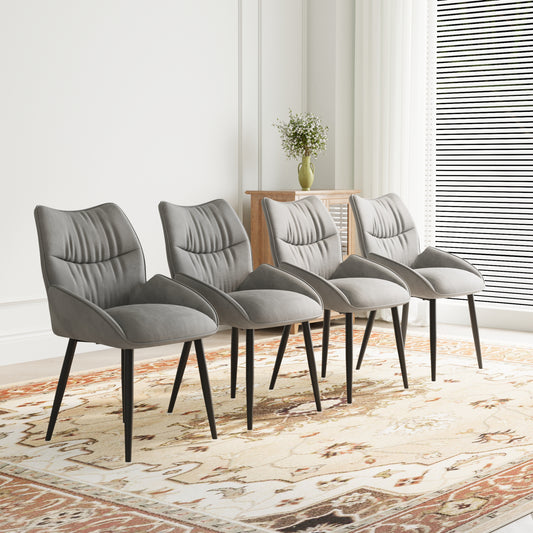 Four upholstered gray dining chairs with black legs on a patterned rug