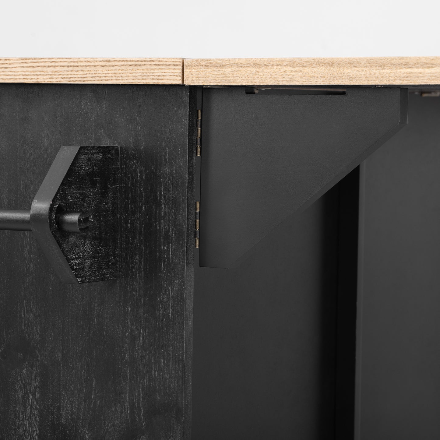 Black wooden side table with brushed metal drawer pull detail