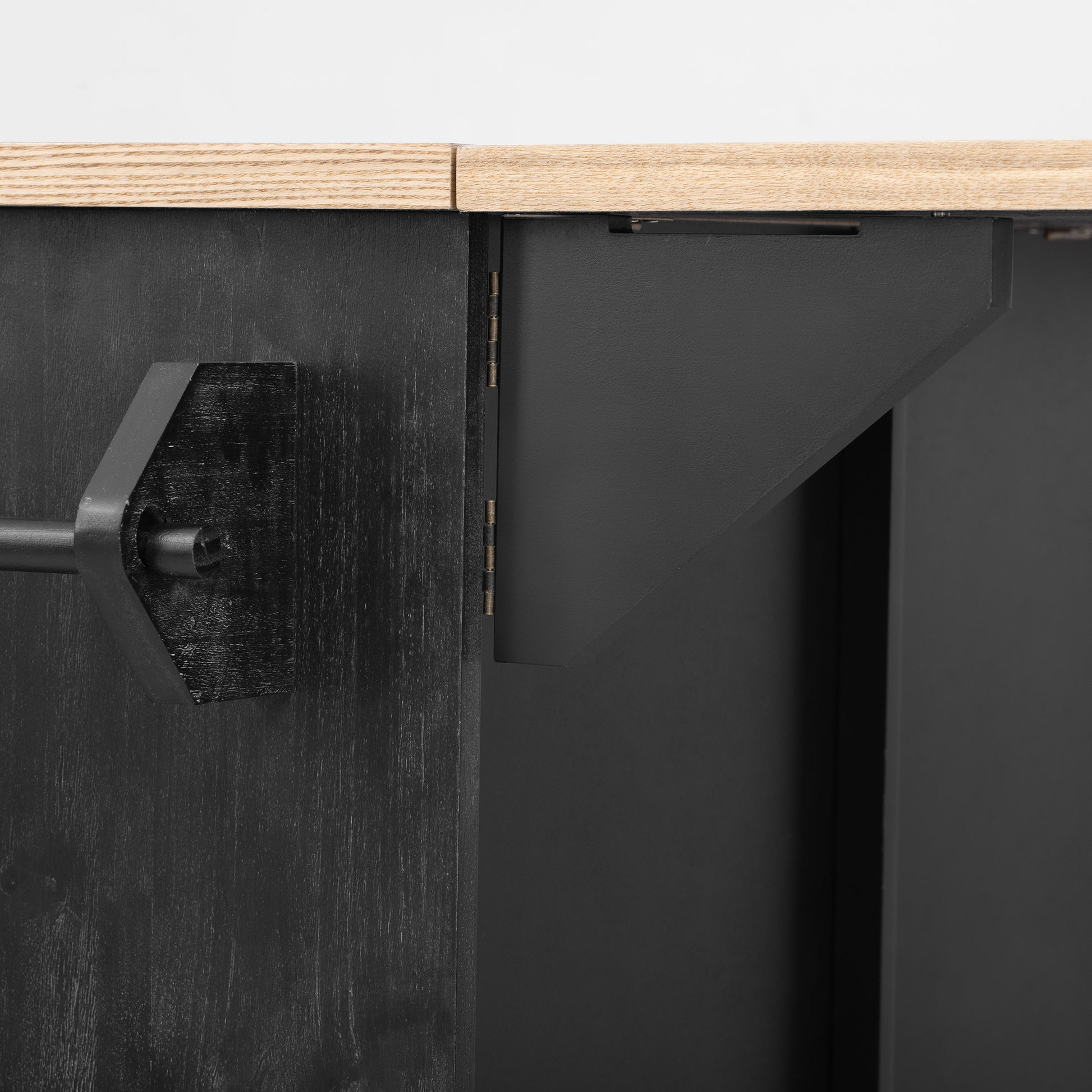 Black wooden side table with brushed metal drawer pull detail