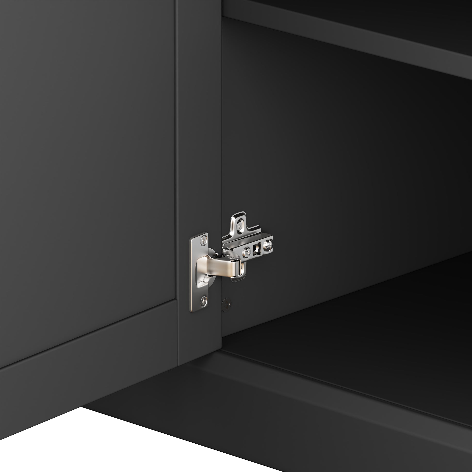Closeup of brushed nickel cabinet hinge on dark gray cabinet door
