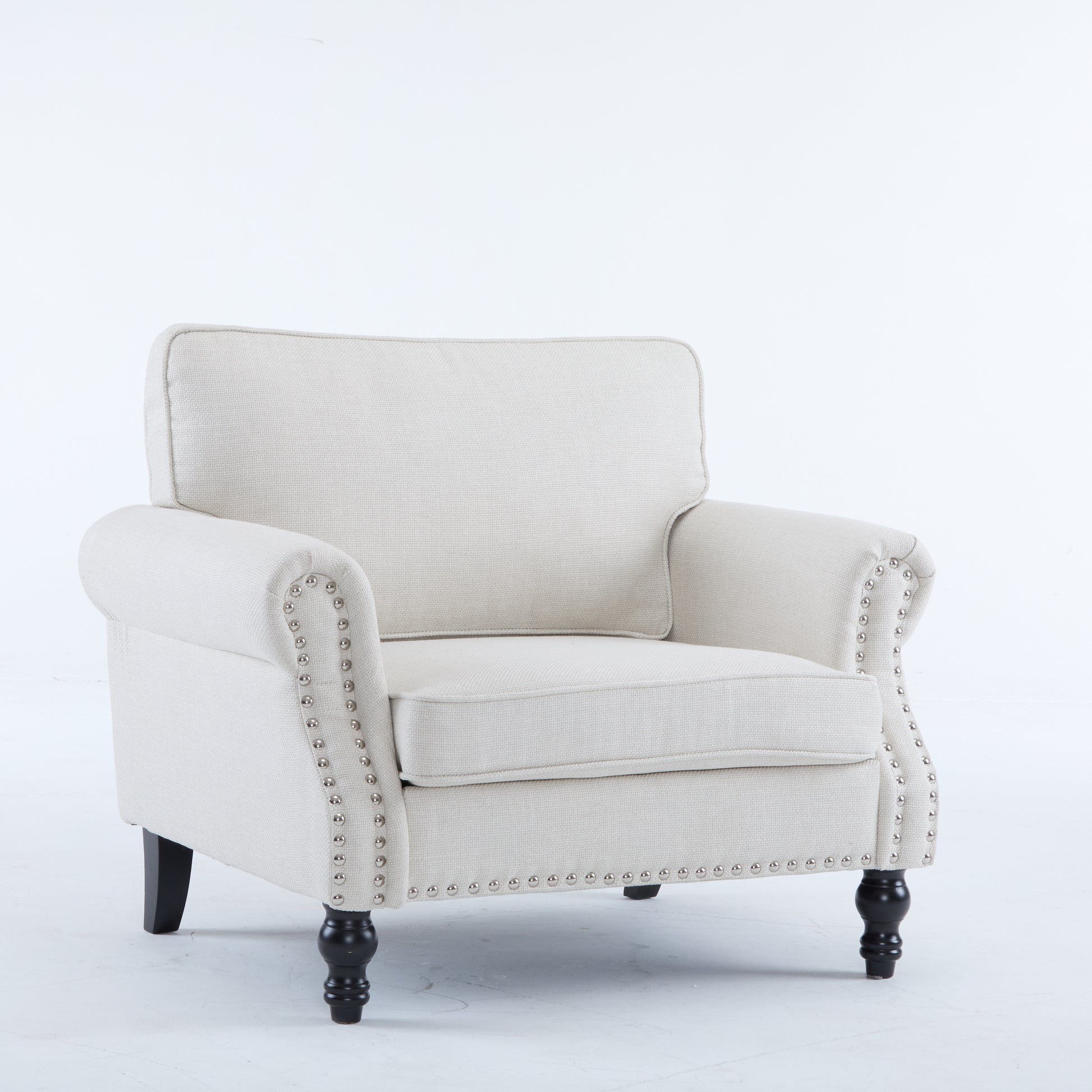 Cream fabric accent chair with nailhead trim and turned legs