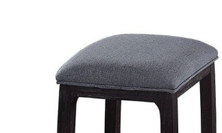Gray upholstered counter stool with dark wood frame